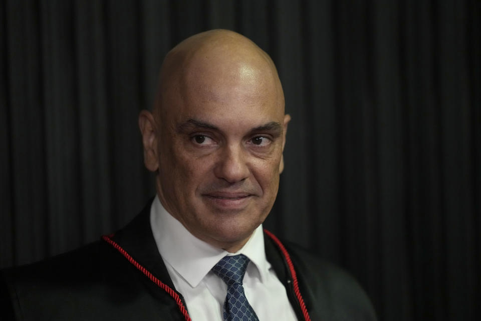 FILE - Judge Alexandre de Moraes stands as he is sworn in as the new head of the Supreme Electoral Tribunal, the government body that oversees elections, ahead of the Oct. 2 elections in Brasilia, Brazil, Tuesday, Aug. 16, 2022. The Superior Electoral Court, the country's top electoral authority, announced Thursday, Oct, 20, that it would be banning "false or seriously decontextualized" content that “affects the integrity of the electoral process.” No request from a prosecutor or complainant is necessary for the court to take action. (AP Photo/Eraldo Peres, File)