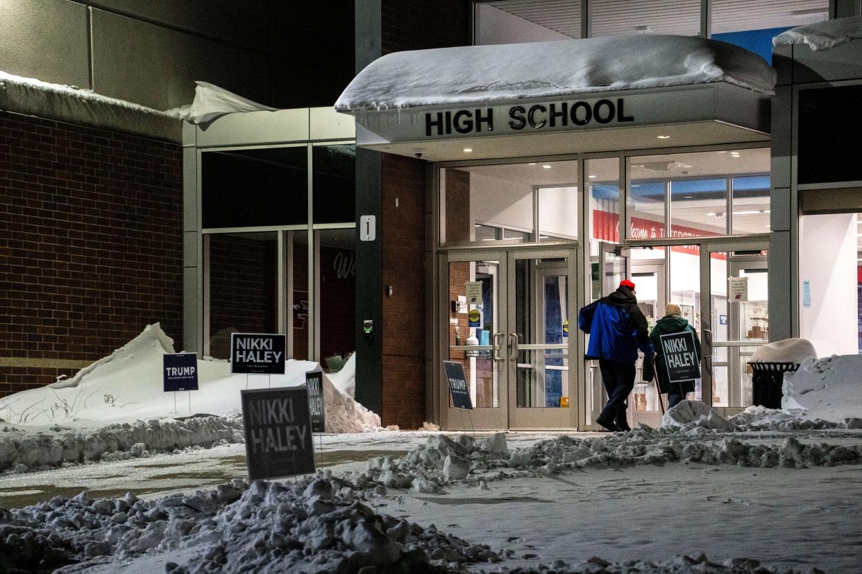 Voters walk into a caucus site on Monday, Jan. 15, 2024, at Interstate-35 High School in Truro.