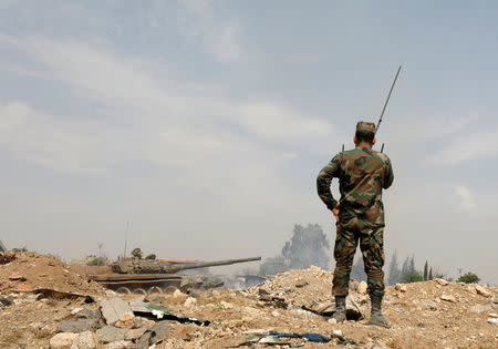 Soldiers loyal to Syria's President Bashar al-Assad forces are deployed at al-Qadam area near Yarmouk Palestinian camp in Damascus,Syria April 29,2018.REUTERS/ Omar Sanadiki