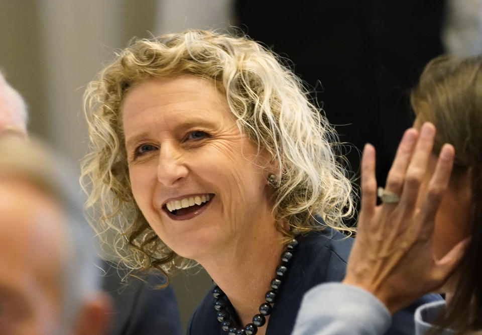 Virginia State Sen. Jen Kiggans, R-Virginia Beach, talks with supporters as she prepares for a debate sponsored by the Hampton roads Chamber of Congress Wednesday, Oct. 12, 2022, in Virginia Beach. Va. (AP Photo/Steve Helber)