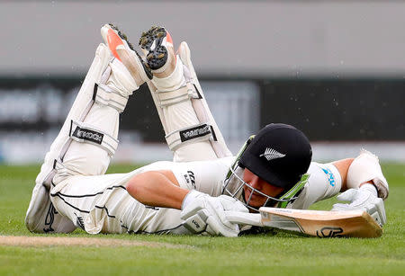 Cricket - Test Match - New Zealand v England - Eden Park, Auckland, New Zealand, March 24, 2018. New Zealand's Bradley-John Watling dives to make his ground during the third day of the first cricket test match. REUTERS/David Gray