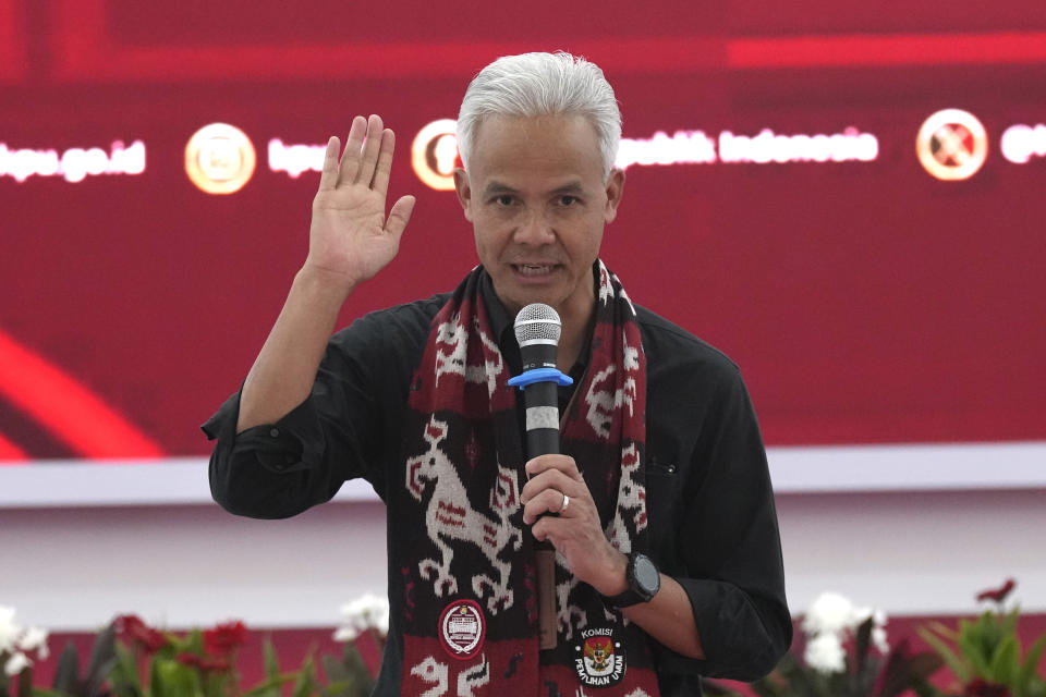 Presidential candidate of the ruling Indonesian Democratic Party of Struggle (PDIP) Ganjar Pranowo gestures as he delivers a speech after officially registering his candidacy to run in the 2024 election at the General Election Commission building in Jakarta, Indonesia, Thursday, Oct. 19, 2023. The world's third-largest democracy is set to vote in simultaneously legislative and presidential elections on Feb. 14, 2024. (AP Photo/Tatan Syuflana)