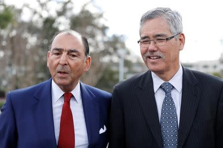 (L-R) Alexander Mehran Sr., chairman and chief executive of Sunset Development Company, and Randell Iwasaki, executive director of the Contra Costa County Transportation District, speak to members of the media during a deployment demonstration of the EasyMile EZ10 shared autonomous vehicle at Bishop Ranch in San Ramon, California March 6, 2017. REUTERS/Stephen Lam