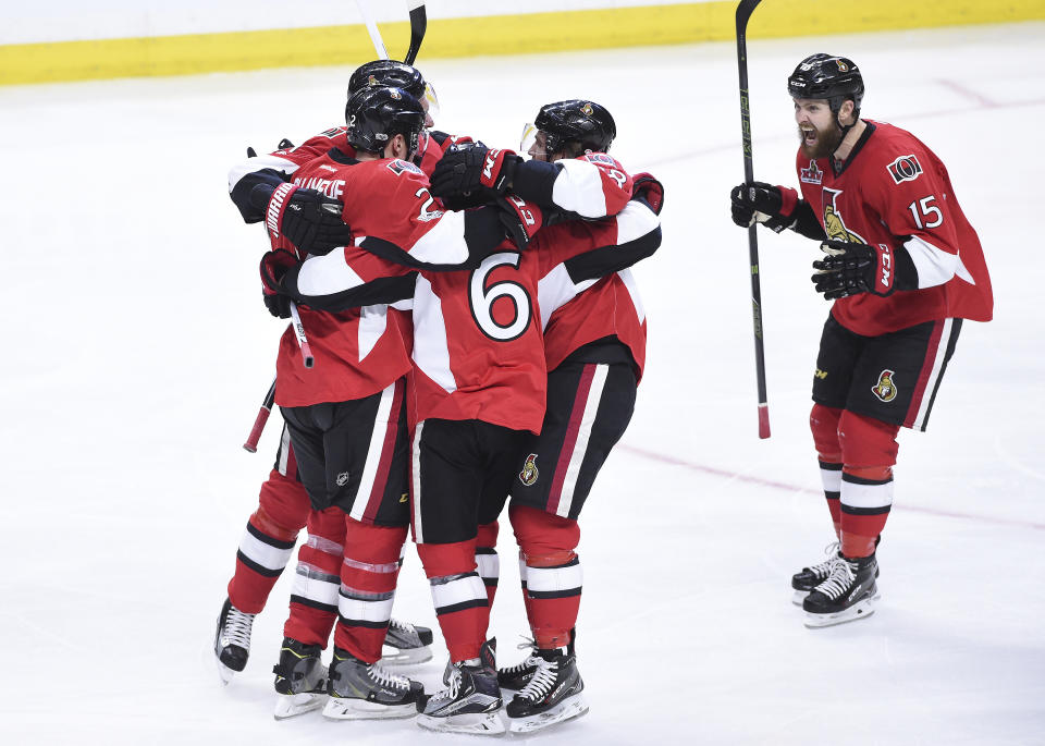 Ottawa Senators celebrate their goal by Ottawa Senators defenseman Chris Wideman (6) during third period of game two NHL Stanley Cup hockey playoff action against the Boston Bruins, in Ottawa, Saturday, April 15, 2017. (Sean Kilpatrick/The Canadian Press via AP)