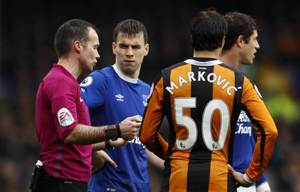 <p>Everton’s Seamus Coleman speaks to referee Paul Tierney as Hull City’s Lazar Markovic looks on </p>