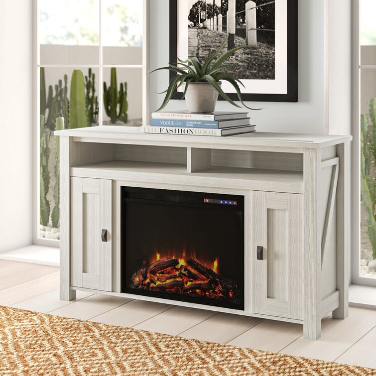 <p><a href="https://go.redirectingat.com?id=74968X1596630&url=https%3A%2F%2Fwww.wayfair.com%2Ffurniture%2Fpdp%2Fmistana-whittier-tv-stand-for-tvs-up-to-50-with-electric-fireplace-included-w006117159.html&sref=https%3A%2F%2Fwww.popularmechanics.com%2Fhome%2Fg37621995%2Fbest-fireplace-tv-stands%2F" rel="nofollow noopener" target="_blank" data-ylk="slk:Shop Now;elm:context_link;itc:0;sec:content-canvas" class="link ">Shop Now</a></p><p>Fireplace TV Stand</p><p>wayfair.com</p><p>$339.99</p>