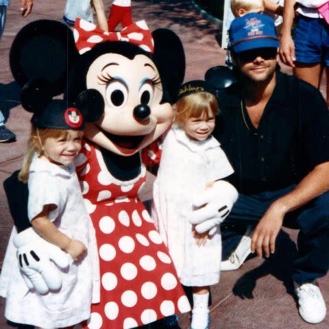 <p>John Stamos/Instagram</p> The Olsen twins and John Stamos pose with Minnie Mouse at Disneyland.