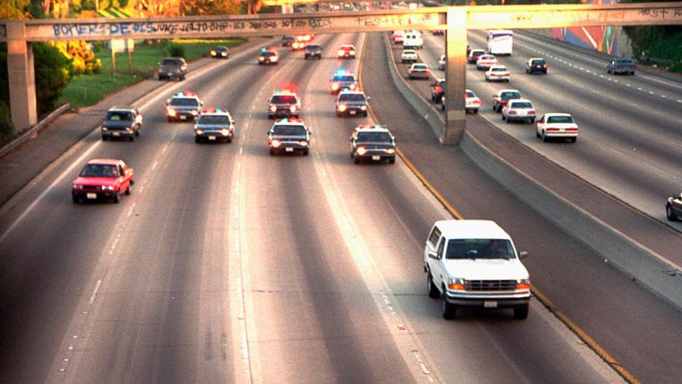 PHOTO: A white Ford Bronco, driven by Al Cowlings carrying O.J. Simpson, is trailed by Los Angeles police cars as it travels on a freeway in Los Angeles, June 17, 1994. (Joseph Villarin/AP/FILE)
