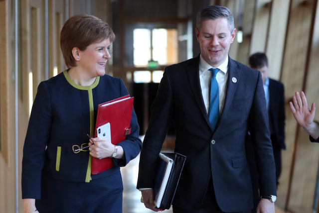 First Minister Nicola Sturgeon and Cabinet Secretary for Finance, Economy and Fair Work Derek Mackay arrive ahead of the budget statement at the Scottish Parliament in Edinburgh.