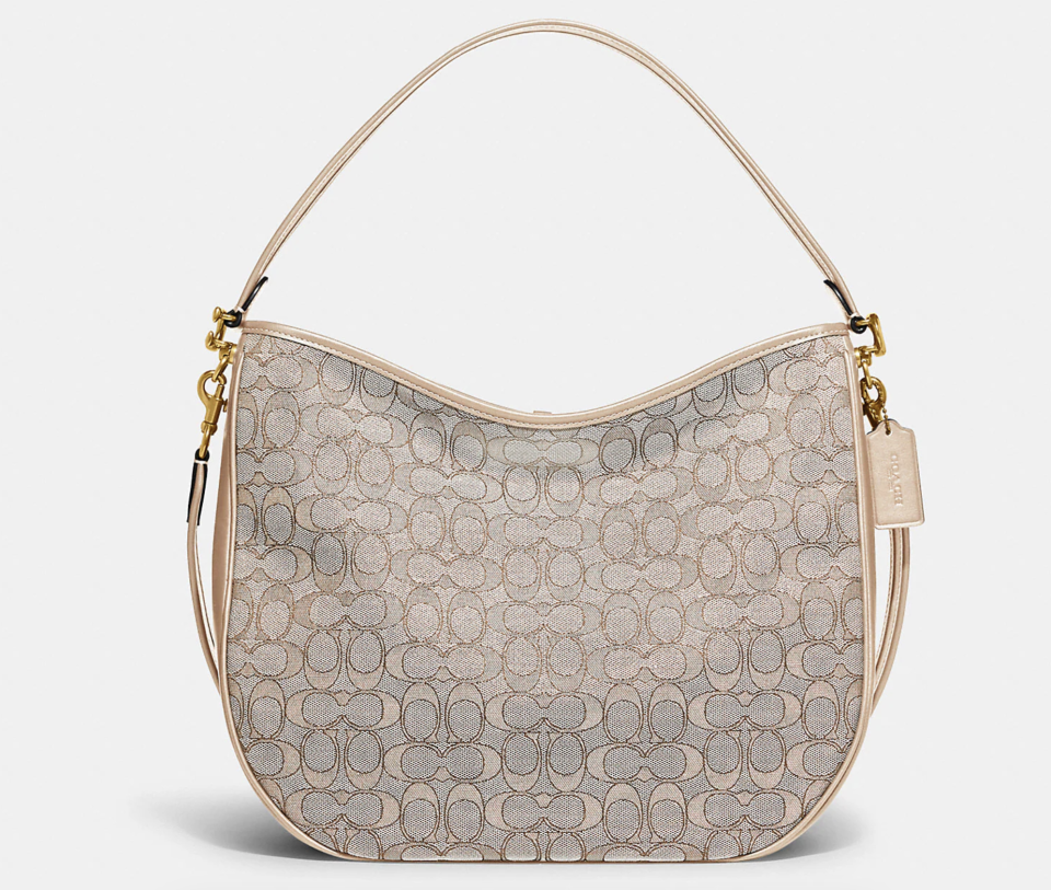 Soft Tabby Hobo In Signature Jacquard. Image via Coacjh Outlet.