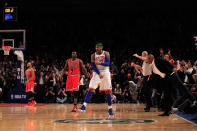 NEW YORK, NY - APRIL 08: Carmelo Anthony #7 of the New York Knicks celebrates his game winning three pointer against as Luol Deng #9 of the Chicago Bulls looks on at Madison Square Garden on April 8, 2012 in New York City. (Photo by Chris Trotman/Getty Images)