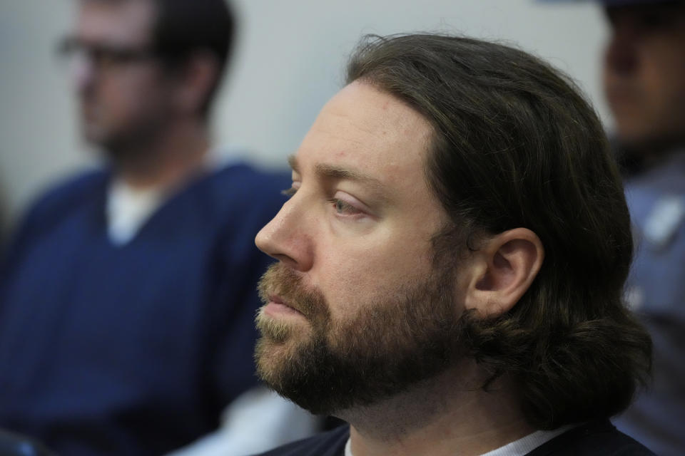 Hunter Elward, a former Rankin County Sheriff's Deputy and one of six former Mississippi law enforcement officers who pleaded guilty to a long list of state and federal charges, sits in the Rankin County Circuit Court and listens as victims impact statements are read, before the state sentencing of his involvement in the 2023 racially motivated torture of two Black men, Wednesday, April 10, 2024, in Brandon, Miss. Rankin County Circuit Judge Steve Ratcliff gave the six former Mississippi law enforcement officers yearslong state sentences that were shorter than the amount of time in federal prison that they had already received. Time served for the state convictions will run concurrently, or at the same time, as the federal sentences, and the men will serve their time in federal penitentiaries. (AP Photo/Rogelio V. Solis)