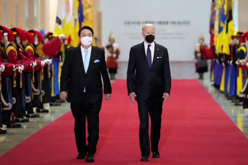 US President Joe Biden and South Korean President Yoon Suk-yeol arrive for a state dinner at the National Museum of Korea in Seoul  (REUTERS)