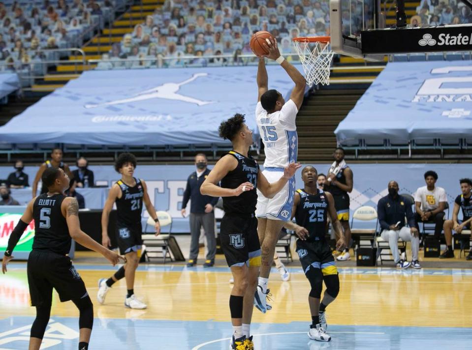 North Carolina’s Garrison Brooks (15) breaks to the basket for a dunk in the first half against Marquette on Wednesday, February 24, 2021 at the Smith Center in Chapel Hill, N.C.