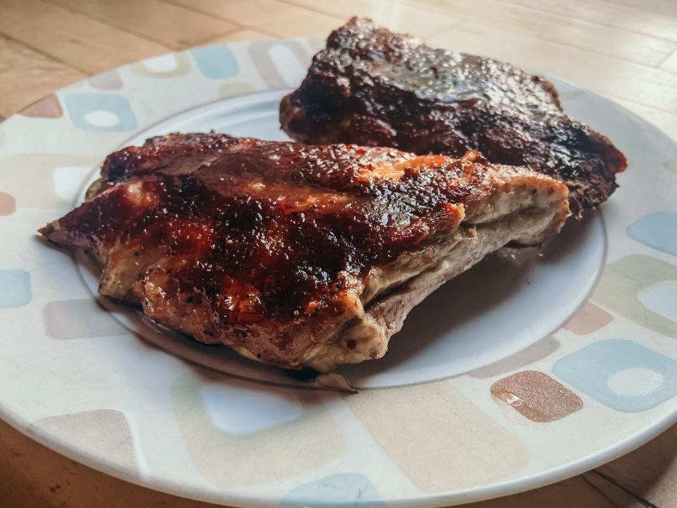 two half racks of ribs on a plate