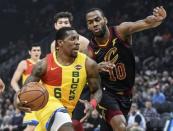 Dec 10, 2018; Milwaukee, WI, USA; Milwaukee Bucks guard Eric Bledsoe (6) drives for the basket against Cleveland Cavaliers guard Alec Burks (10) in the first quarter at the Fiserv Forum. Benny Sieu-USA TODAY Sports