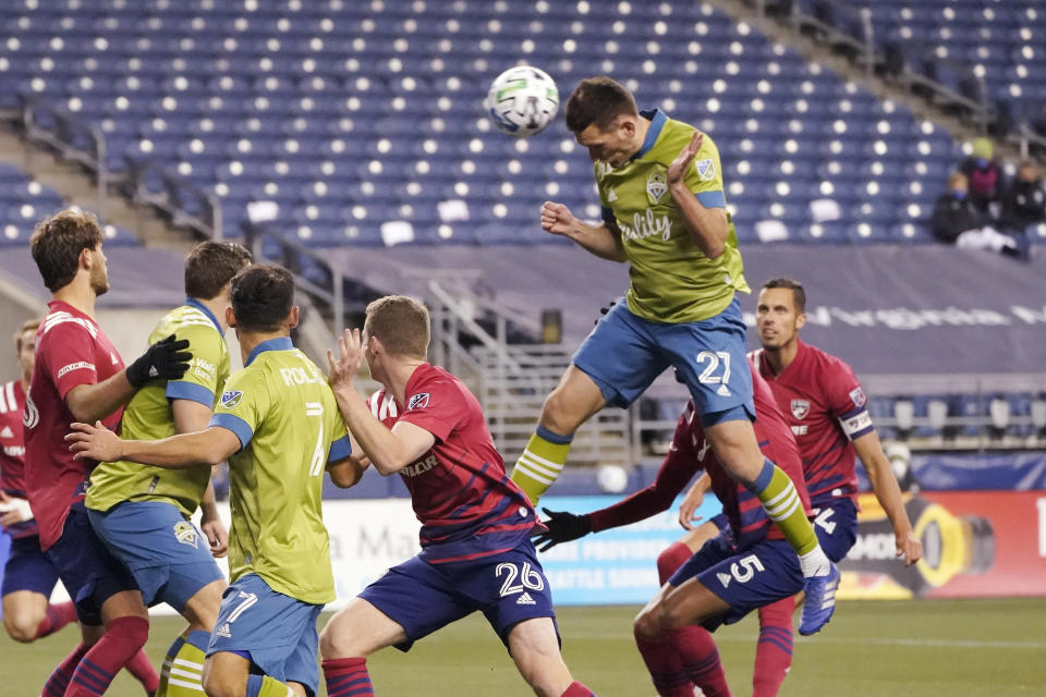 Seattle Sounders defender Shane O'Neill (27) heads in a goal against FC Dallas during the second half of an MLS playoff soccer match, Tuesday, Dec. 1, 2020, in Seattle. (AP Photo/Ted S. Warren)