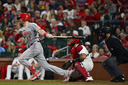 Apr 26, 2019; St. Louis, MO, USA; Cincinnati Reds catcher Curt Casali (12) hits an RBI single off of St. Louis Cardinals starting pitcher Miles Mikolas (not pictured) during the fourth inning at Busch Stadium. Mandatory Credit: Jeff Curry-USA TODAY Sports