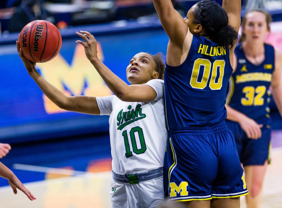 Notre Dame’s Katlyn Gilbert (10) drives against Michigan’s Naz Hillmon (0) during a game Dec. 3, 2020.