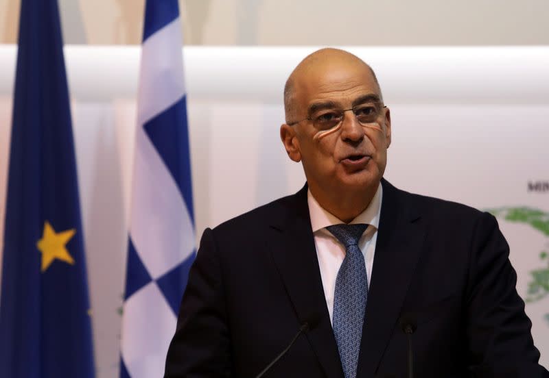 Greek Foreign Minister Nikos Dendias attends a news conference with Cypriot Foreign Minister Nikos Christodoulides at the Foreign Ministry in Nicosia,