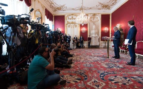 Austrian President Alexander Van der Bellen, left, and Austrian Chancellor Sebastian Kurz, of the Austrian People's Party, OEVP, right, address the media during a news conference after their meeting at the Hofburg palace in Vienna, Austria, Tuesday, May 21, 2019 - Credit: Michael Gruber/AP