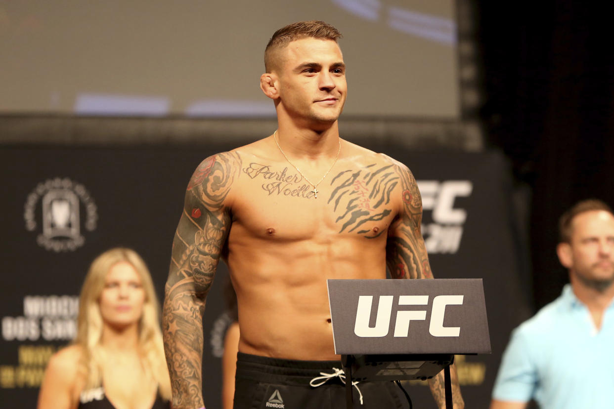 Dustin Poirier poses for photographers during a weigh-in on May 12 in Dallas before UFC 211. ( AP)