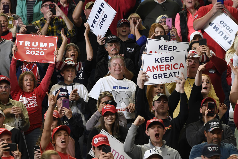 People in the crowd react as President Donald Trump speaks at a campaign rally in, Lexington, Ky., Monday, Nov. 4, 2019. (AP Photo/Susan Walsh)