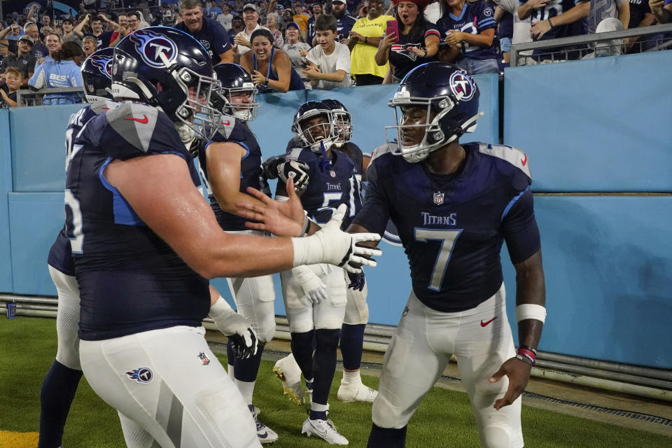 Tennessee Titans quarterback Malik Willis (7) celebrates his touchdown pass to wide receiver Kearis Jackson (5) in the second half of an NFL preseason football game against the New England Patriots Friday, Aug. 25, 2023, in Nashville, Tenn. (AP Photo/George Walker IV)
