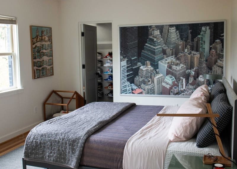 Photo of city skyline in newly renovated bedroom.