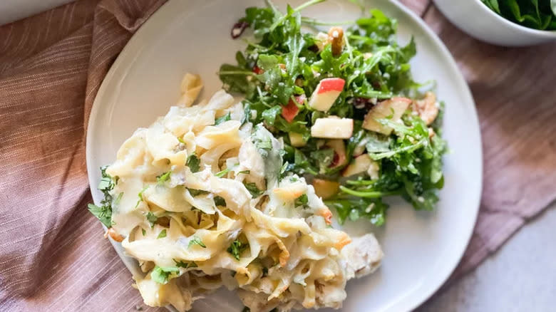 Chicken casserole and salad on plate