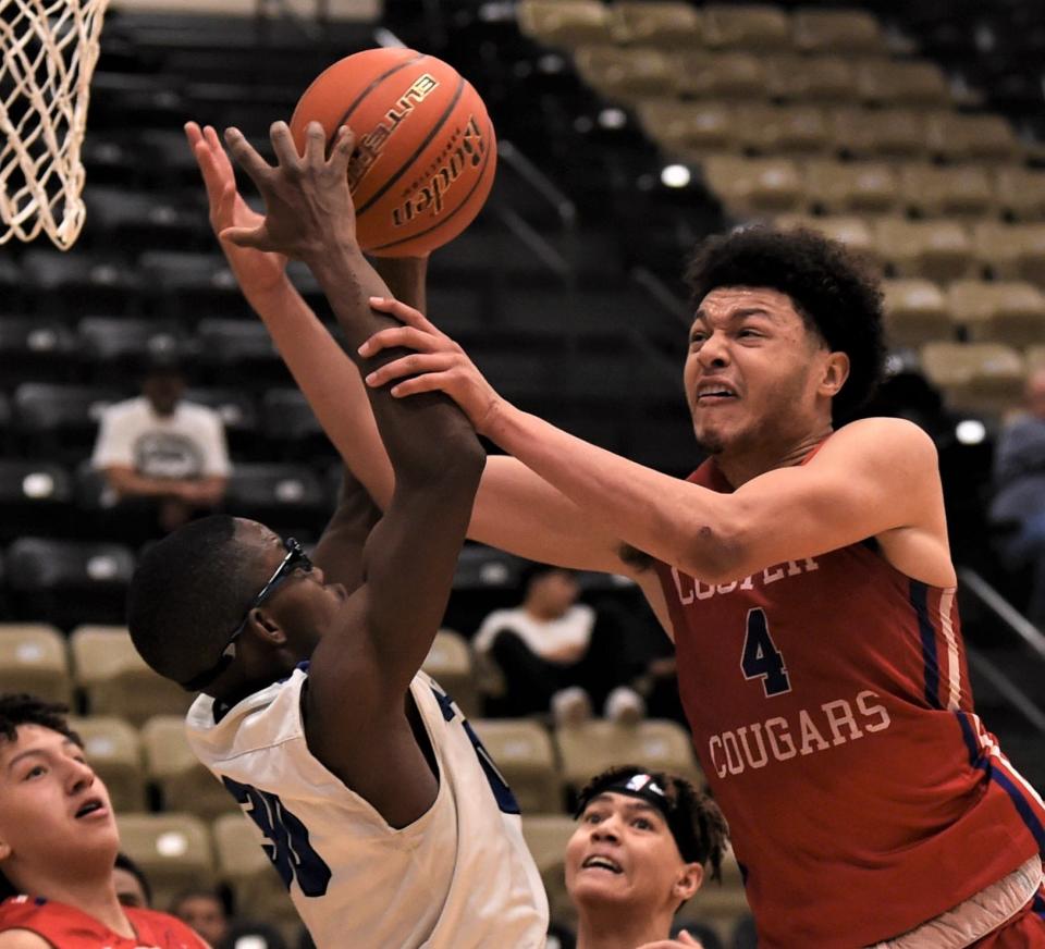 Cooper's Jaelyn Rivera, right, battles Amarillo Palo Duro's Kent Pierson for a rebound.