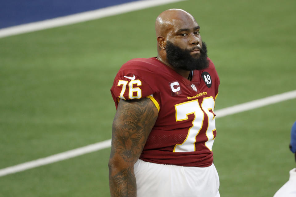 Washington Football Team offensive tackle Morgan Moses stands on the field before an NFL football game against the Dallas Cowboys in Arlington, Texas, Thursday, Nov. 26, 2020. (AP Photo/Roger Steinman)