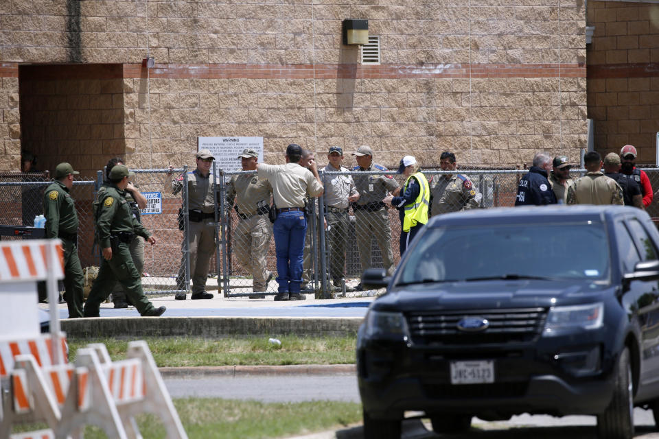 FILE - Law enforcement, and other first responders, gather outside Robb Elementary School following a shooting, May 24, 2022, in Uvalde, Texas. A criminal investigation in Texas over the hesitant police response to the Robb Elementary School shooting remains ongoing a year after a gunman killed 19 children and two teachers in Uvalde. (AP Photo/Dario Lopez-Mills, File)