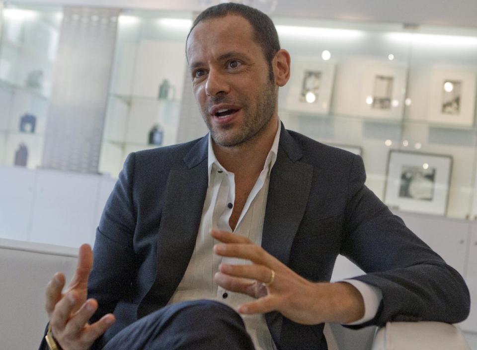 Salvatore Ferragamo's creative director, Massimiliano Giornetti, talks during an interview with the Associated Press, in Paris, Thursday, June 14, 2012. (AP Photo/Jacques Brinon)