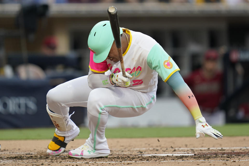 San Diego Padres' Juan Soto falls after being hit by a pitch while batting during the third inning of a baseball game against the Arizona Diamondbacks, Wednesday, Sept. 7, 2022, in San Diego. (AP Photo/Gregory Bull)