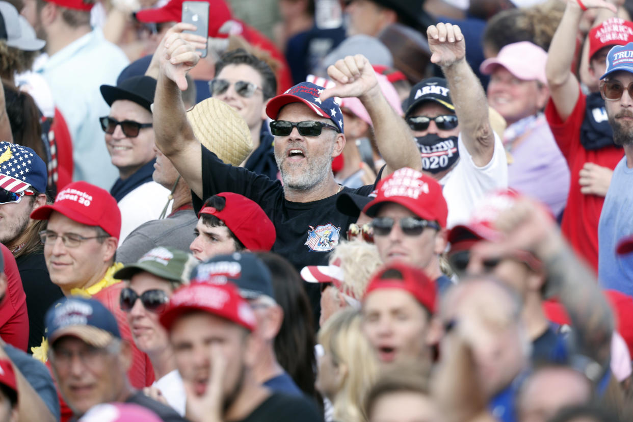 Supporters of President Donald Trump show their disdain shouting "CNN sucks" during his campaign speech just four days before Election Day outside of Raymond James Stadium on October 29, 2020 in Tampa, Florida. (Octavio Jones/Getty Images)