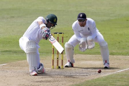 South Africa's Dean Elgar (L) plays a shot as England's Jonny Bairstow looks on during the first cricket test match in Durban, South Africa, December 27, 2015. REUTERS/Rogan Ward