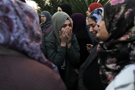 Relatives and friends react as the coffin carrying the body of Aiia Maasarwe, 21, an Israeli student killed in Melbourne, arrives before her funeral in her home town of Baqa Al-Gharbiyye, northern Israel January 23, 2019. REUTERS/Ammar Awad