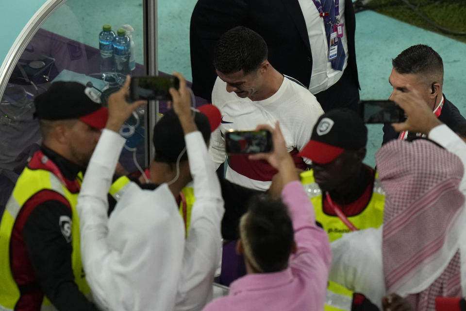 Portugal's Cristiano Ronaldo, center, reacts as he leaves the field after their loss in the World Cup quarterfinal soccer match against Morocco, at Al Thumama Stadium in Doha, Qatar, Saturday, Dec. 10, 2022. (AP Photo/Alessandra Tarantino)