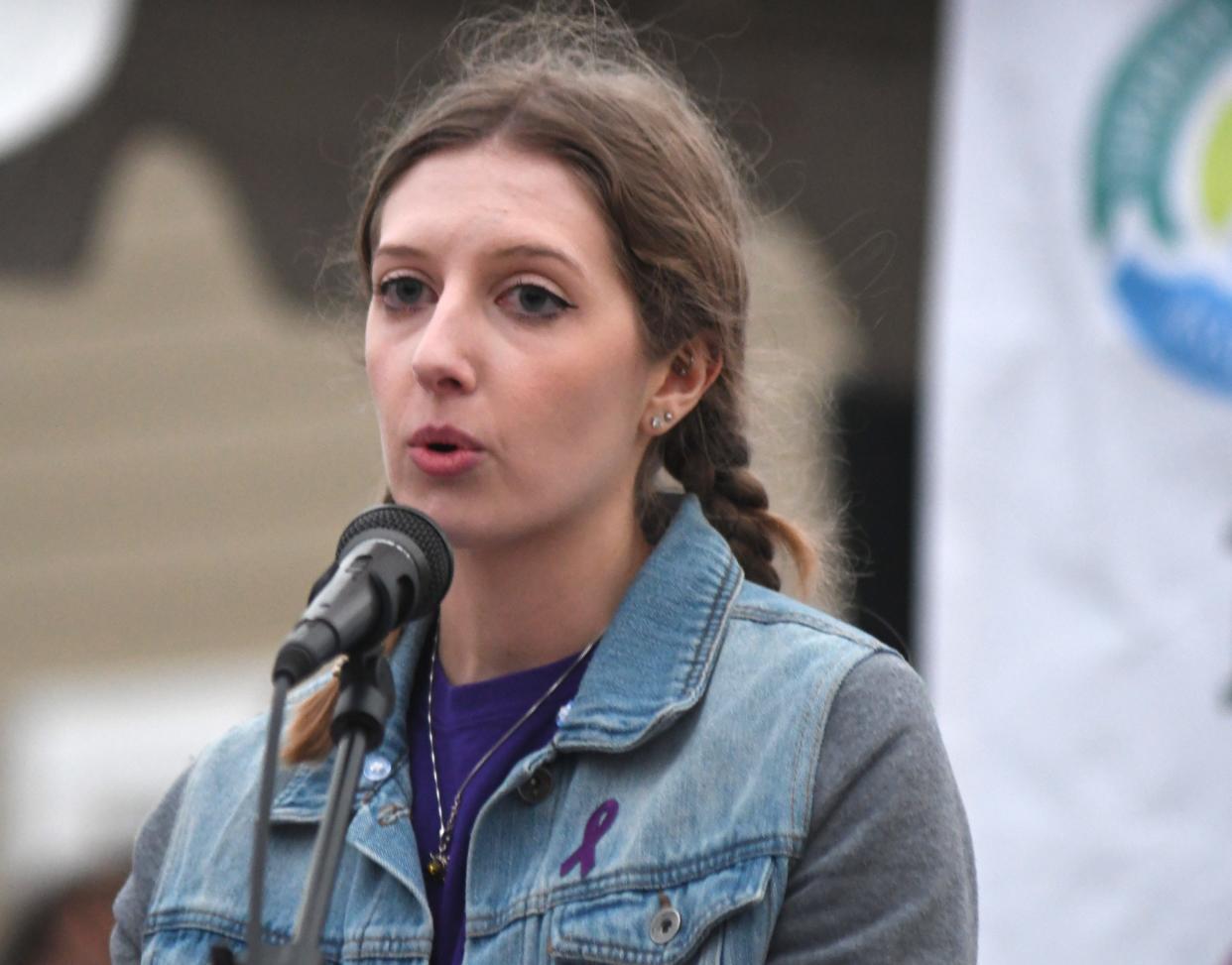 Rachel Knowles speaks during a ceremony in honor of her mother, MaryAnn Breault, at Holly Tree Racquet Club in Wilmington in 2022. Breault was killed in a domestic violence dispute in front of the club.