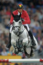 Marco Kutscher of Germany and his horse Cornet Obolensky compete in the Mercedes-Benz Price team jumping competition. (Photo by Dennis Grombkowski/Bongarts/Getty Images)