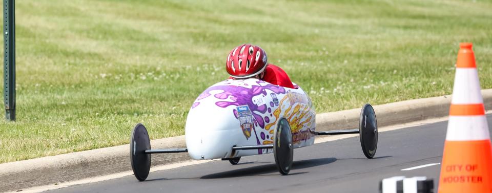 Meredith Brown races across the finish line at the Wayne-Holmes Soap Box Derby.