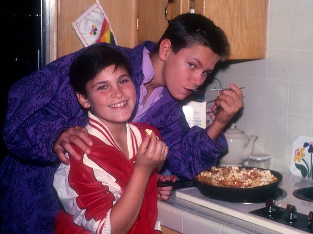 Dianna Whitley/Getty Joaquin Phoenix with his late older brother River Phoenix cooking at their home in Los Angeles, California, circa 1985.