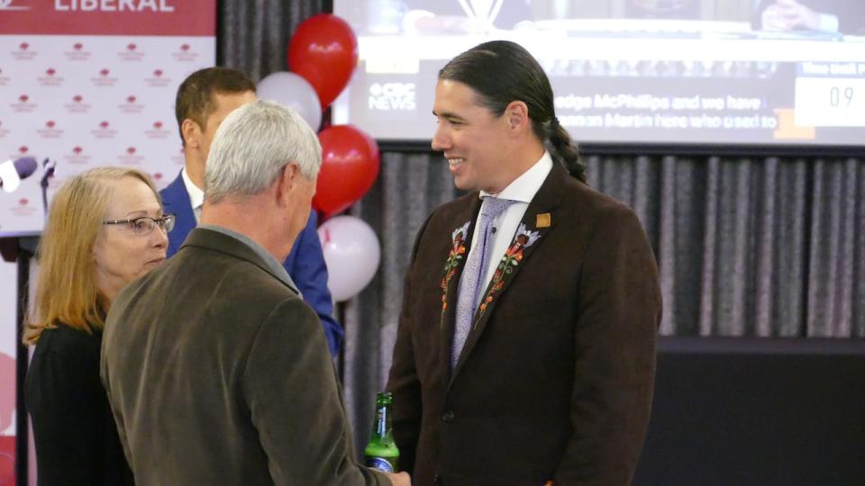 Liberal candidate Robert-Falcon Ouellette speaks with supporters at the Norwood Hotel in Winnipeg on Tuesday evening. Ouellette is running to become the MLA of the Southdale riding in south Winnipeg.