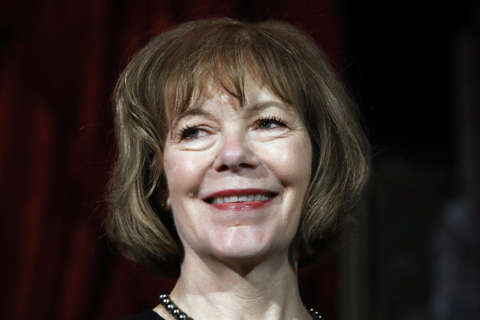 FILE - In this Jan 3, 2018, file photo, Sen. Tina Smith, D-Minn., smiles after being administered the Senate oath of office during a mock swearing in ceremony with Vice President Mike Pence in the Old Senate Chamber on Capitol Hill in Washington. The sudden downfall of Sen. Al Franken amid the rise of the #MeToo movement could set up a two-woman race for his seat, part of an unusual primary featuring both of Minnesota's Senate seats on the same ballot. Franken's successor, Democrat Tina Smith, and the endorsed Republican candidate, state Sen. Karin Housley, were heavy favorites in their respective races. (AP Photo/Jacquelyn Martin, File)