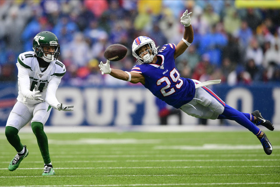 Buffalo Bills cornerback Kevin Johnson (29) defends a pass to New York Jets wide receiver Robby Anderson (11) during the first half of an NFL football game Sunday, Dec. 29, 2019, in Orchard Park, N.Y. (AP Photo/David Dermer)