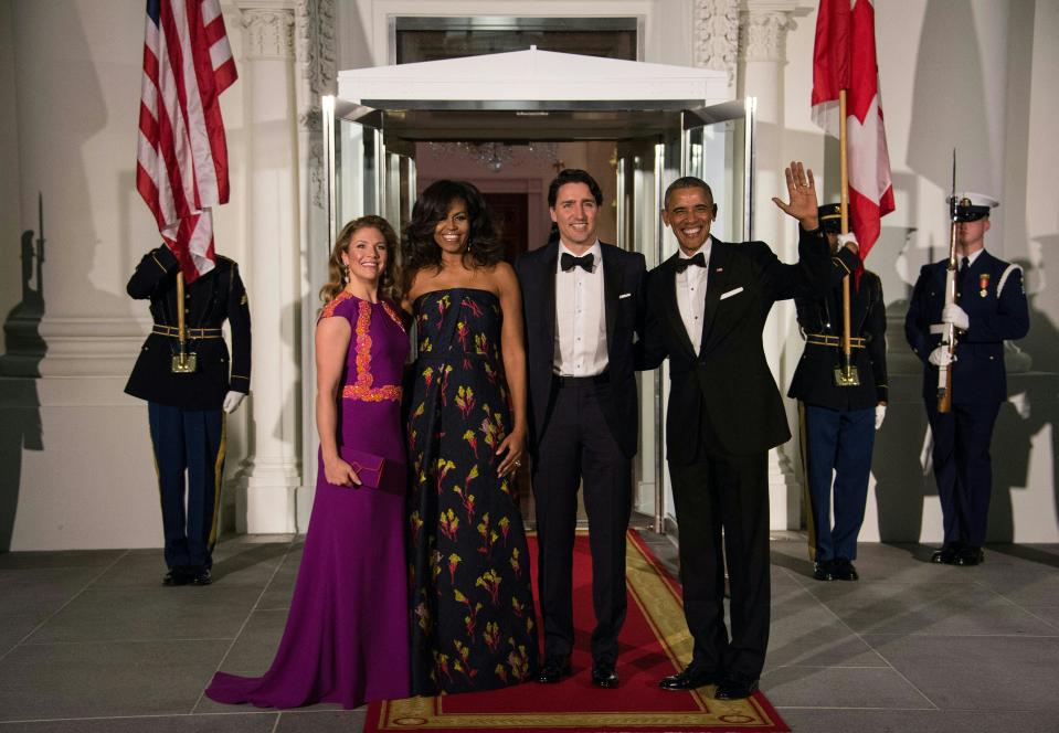 U.S. President Barack Obama (far right), Canadian Prime Minister Justin Trudeau (second right) and their wives Michelle Obama (second left) and Sophie Grégoire Trudeau (far left) pose March 10, 2016. (Photo by NICHOLAS KAMM/AFP via Getty Images)