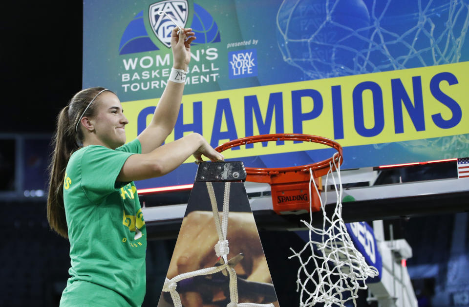 Oregon's Sabrina Ionescu (20) reacts while cutting down the net after defeating Stanford in an NCAA college basketball game in the final of the Pac-12 women's tournament Sunday, March 8, 2020, in Las Vegas. (AP Photo/John Locher)