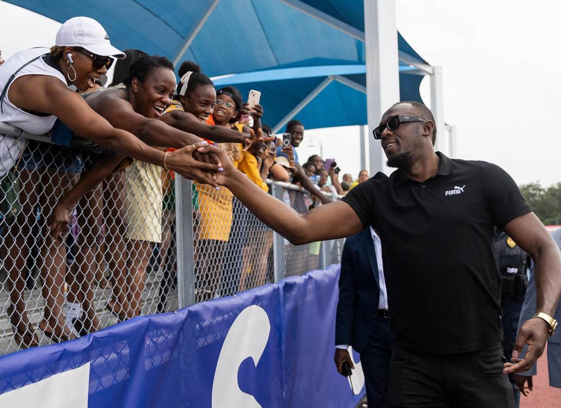 Olympic gold medalist Usain Bolt greets fans during an event at the Ansin Sports Complex on Saturday, July 15, 2023, in Miramar, Fla. Bolt was honored by the city of Miramar during the public event where a bronze sculpture of him was unveiled.
