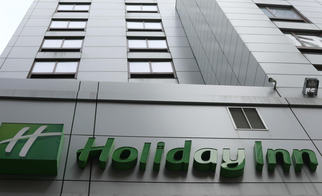 FILE - In this file photo dated March 28, 2019, the sign for a Holiday Inn in New York. The fight to save the seas from plastic waste may mean the end for mini bottles of shampoo and other toiletries, after the owner of Holiday Inn and InterContinental Hotels announced Tuesday July 30, 2019, that it will switch to bulk-size bathroom amenities across the hotel group. (AP Photo/Jenny Kane, FILE)